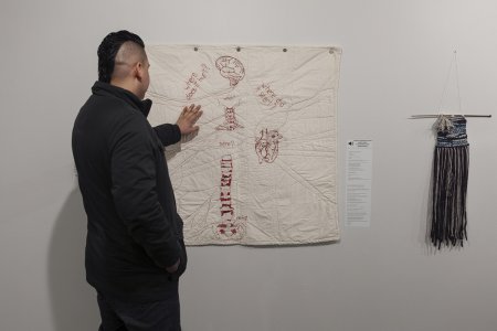 machine-sewn quilt with embroidery thread on raw cotton and accompanying poem